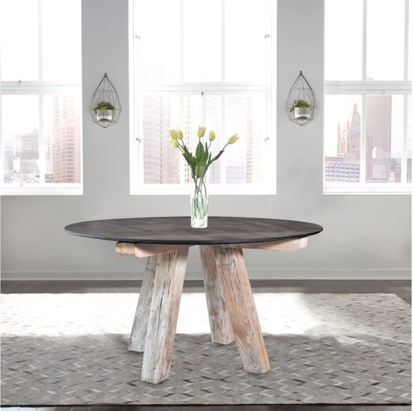 Bowral black marble top dining table on a grey rug in an apartment with large windows in the background.